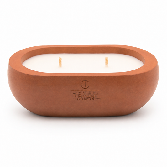 Alma Cinnamon Drift hand-cast stone soy candle — terracotta vessel with embossed Texan Crafts mark, on white