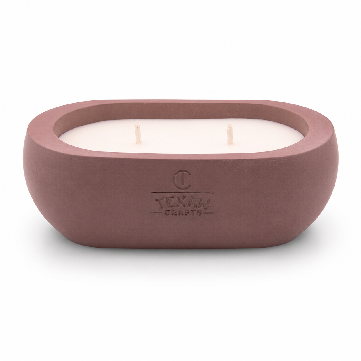 Alma Slow Roast hand-cast stone soy candle — rosewood vessel with embossed Texan Crafts mark, on white
