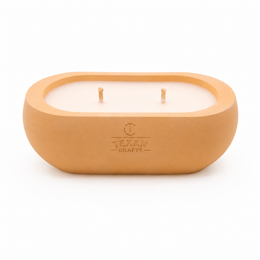 Alma Sunday Loaf hand-cast stone soy candle — wheat vessel with embossed Texan Crafts mark, on white