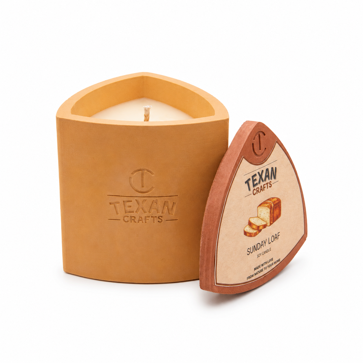 Mica Sunday Loaf hand-cast stone soy candle — wheat vessel with embossed Texan Crafts mark, on white